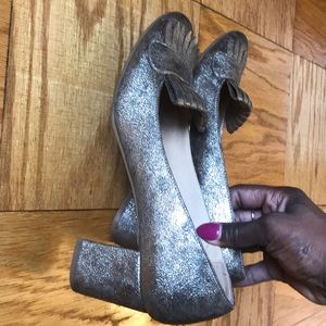 Sparkly gold loafers with fringes